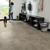 Sandstorm RKT3010-G lvt floors in a mudroom with a kid and dog leaving through the back door