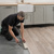 Professional installing Limed Coastal Oak rigid core lvp in a kitchen