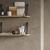 Textured wall with open shelves 