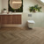 Duxbury Acacia herringbone wood LVT flooring in a bathroom