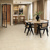 Natural Limestone gluedown lvt floors in an open plan kitchen and dining room