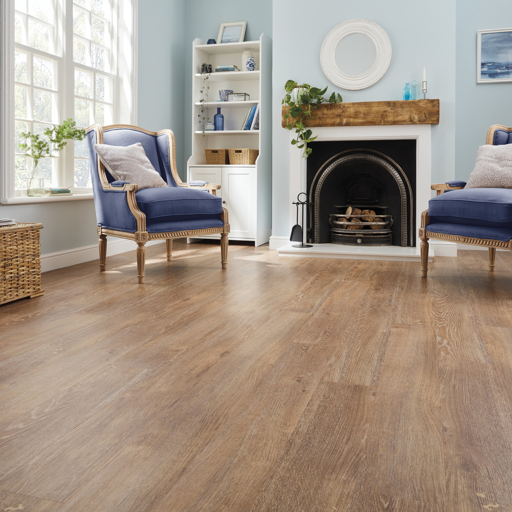 Honey Oak lvp floors in a living room; availabile in gluedown and rigid core